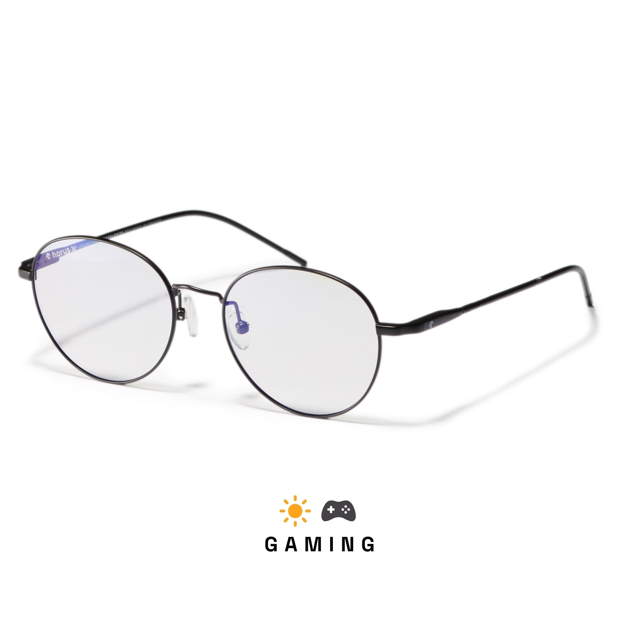 Lunettes gaming anti lumière bleue rondes en métal noir avec verres clairs et plaquettes de nez sur fond blanc