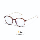 Lunettes sydney anti lumière bleue rondes, monture en polycarbonate tortoise brillant, branches dorées sur fond blanc